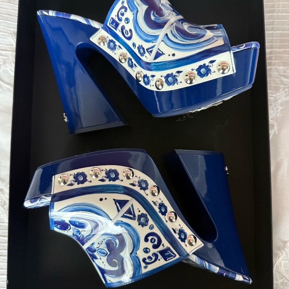 Dolce & Gabbana's mules are punctuated with the brand's painterly Majolica print